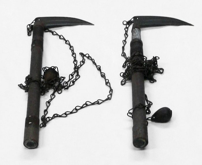Two kusarigama: sickles with chains attached to the handle